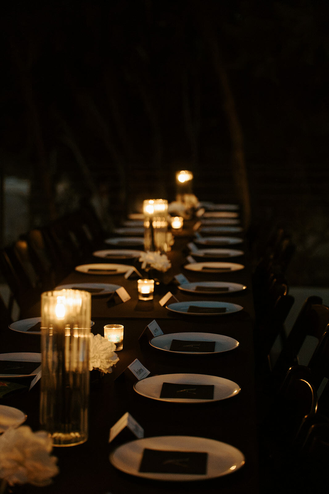 Candlelit dinner table prepared for guests at Las Luces Village