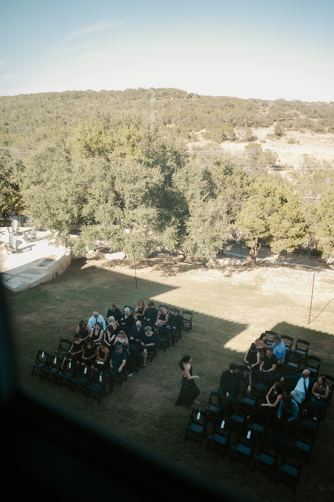 Wedding guests gathering on the ceremony lawn at Las Luces Village