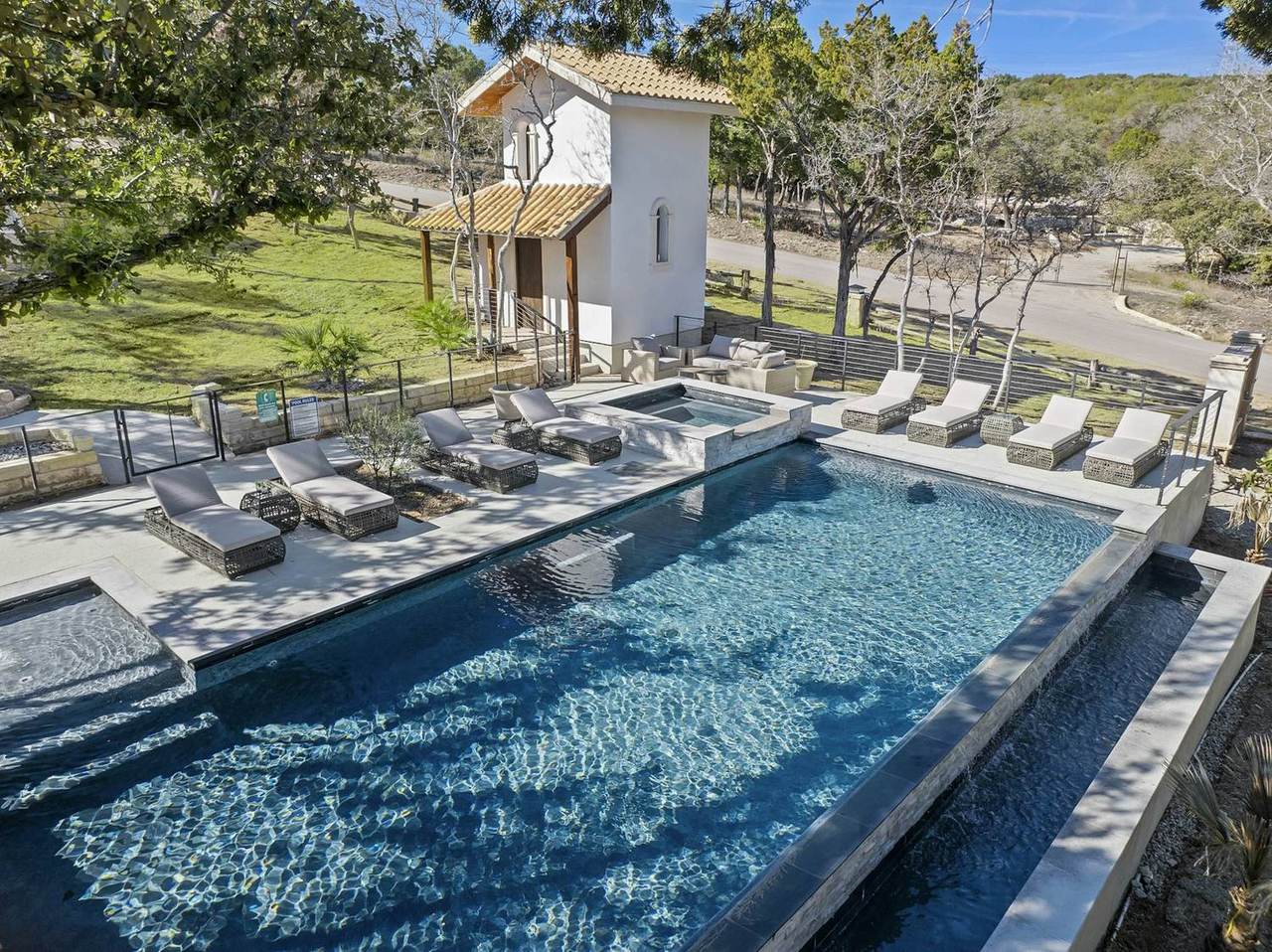 Sun loungers along the pool deck at Las Luces Village