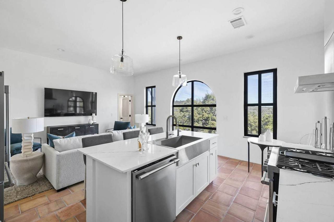 Fully equipped villa kitchen with island seating at Las Luces Village